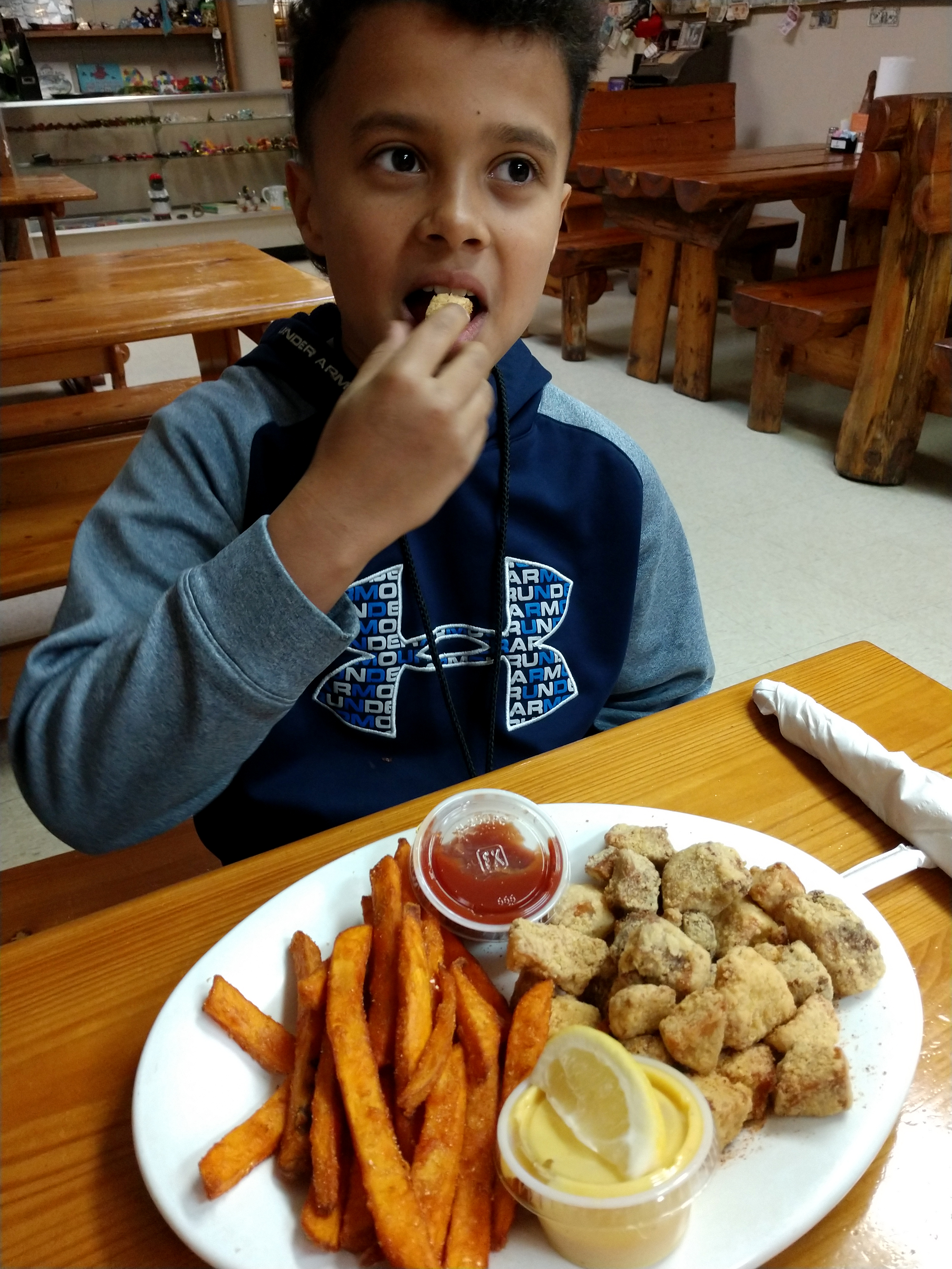 Ruell eating alligator nuggets